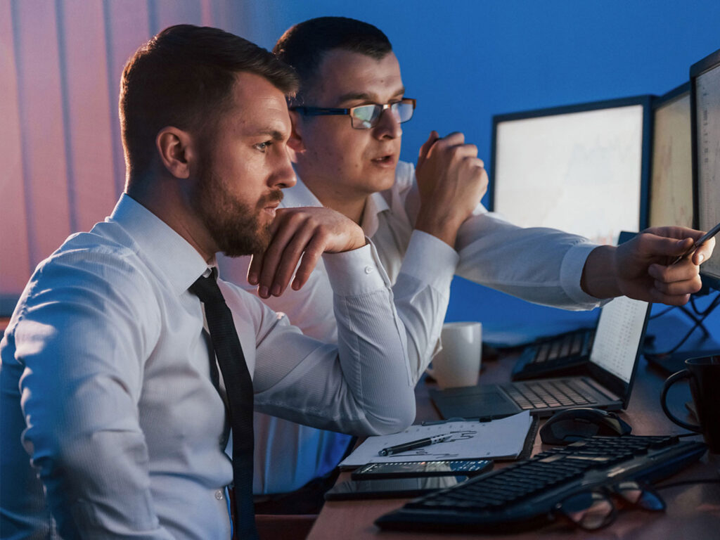 two men looking at security system