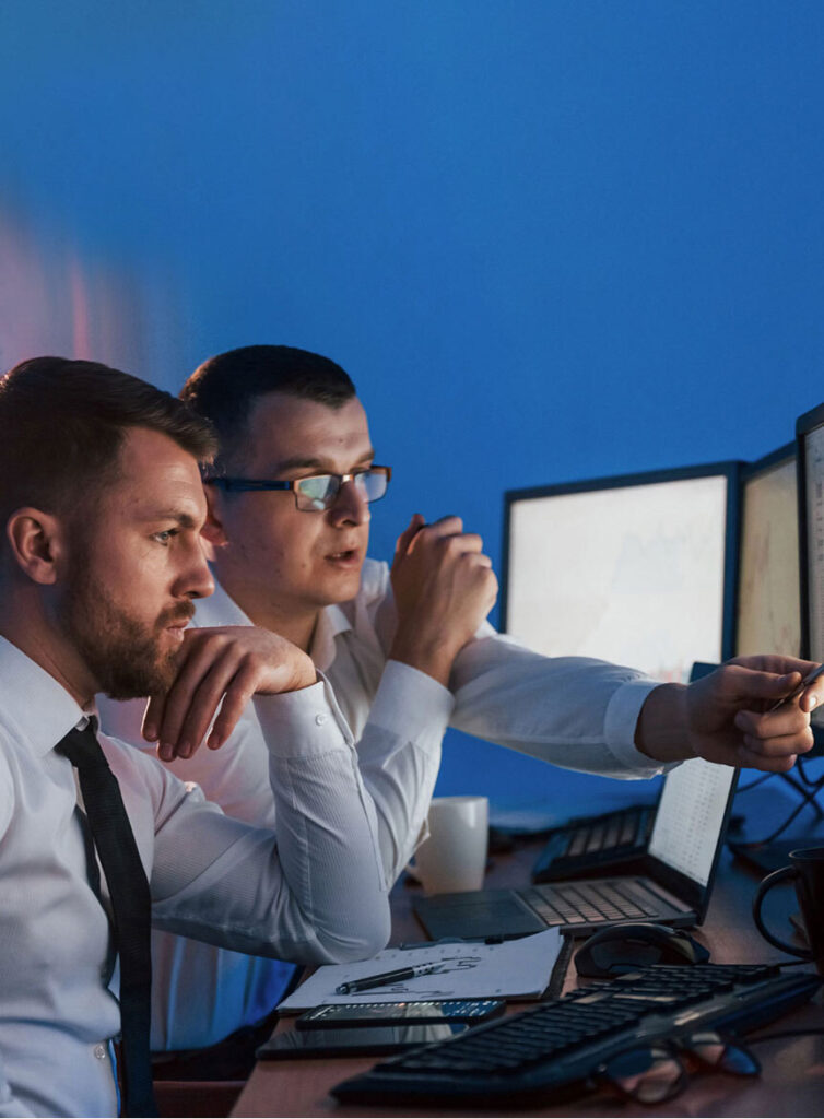 two men looking at security system